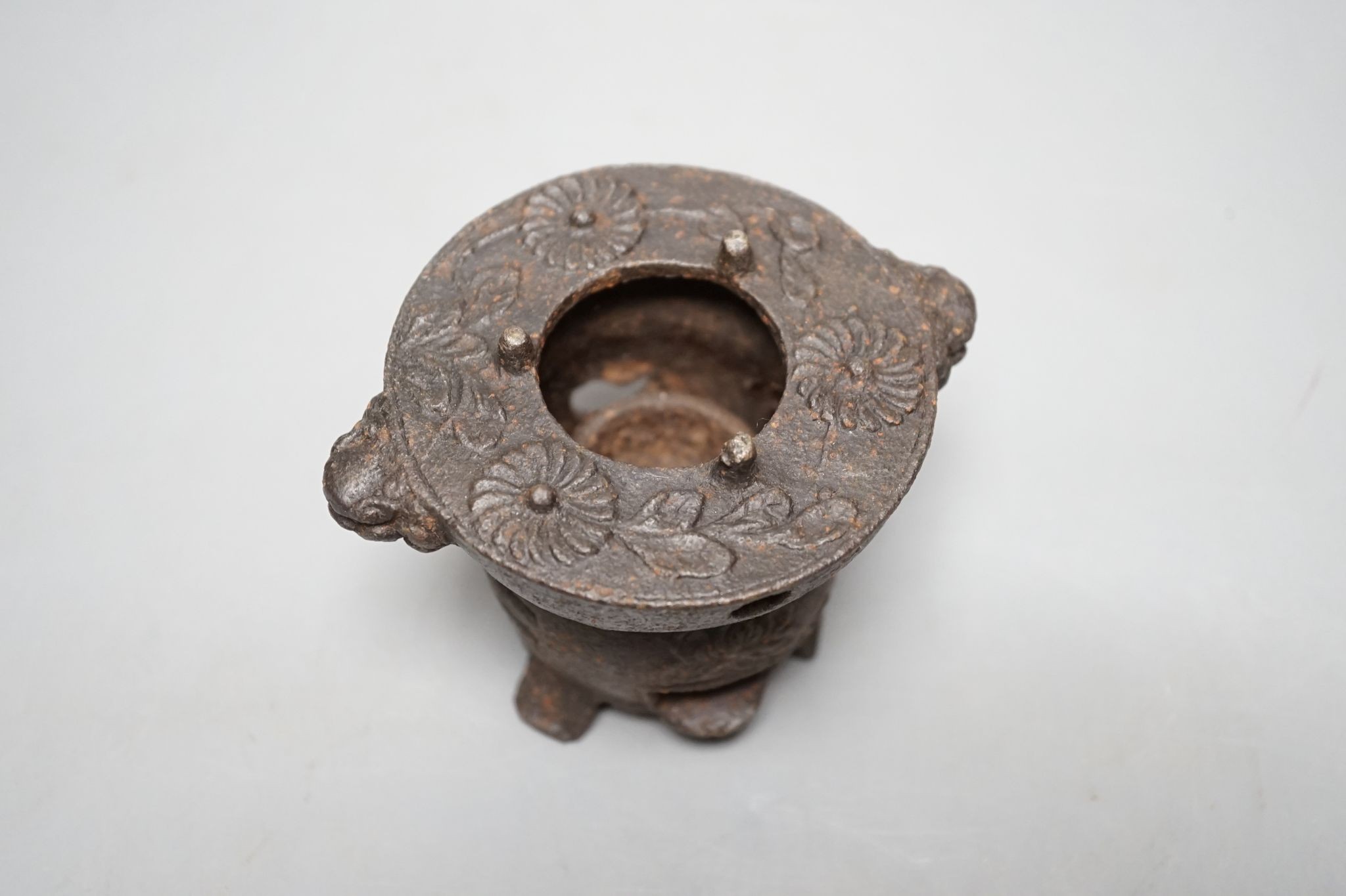 A Japanese cast iron burner stand, 6.5 cms high.